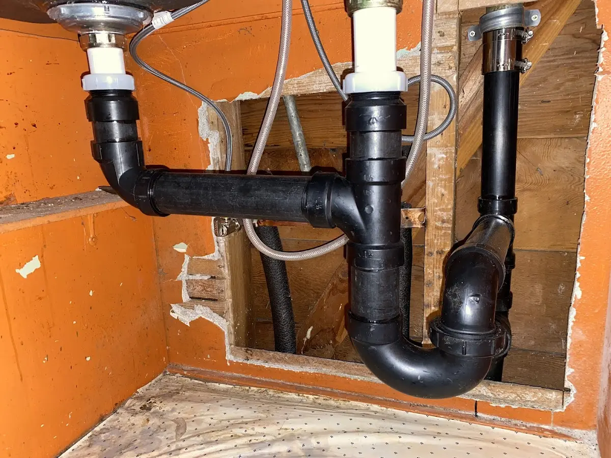Professional Garbage Disposal Repair equipment and tools on the job in Erie